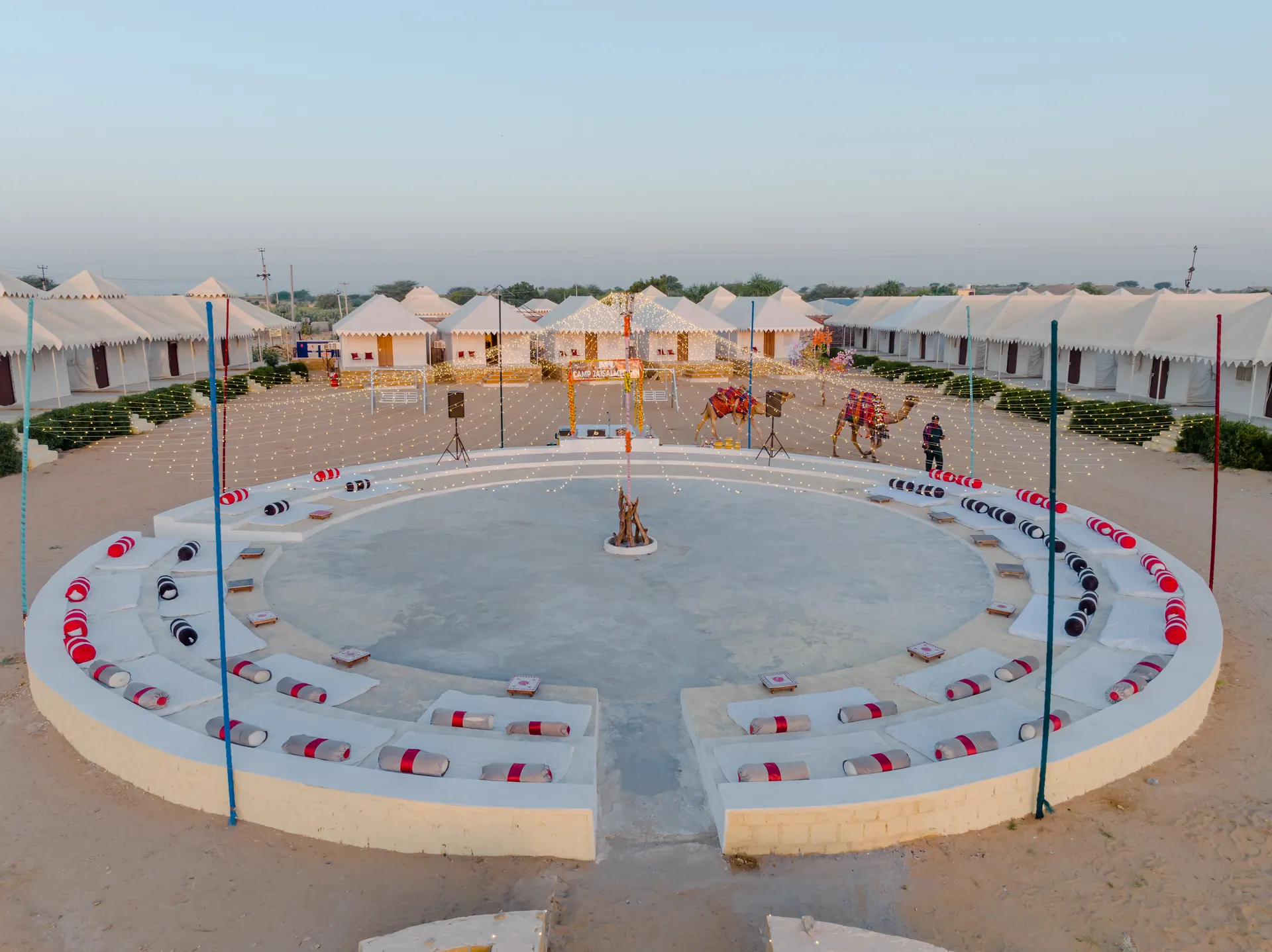 Camp Jaisalmer Inn tents and cultural arena at dusk